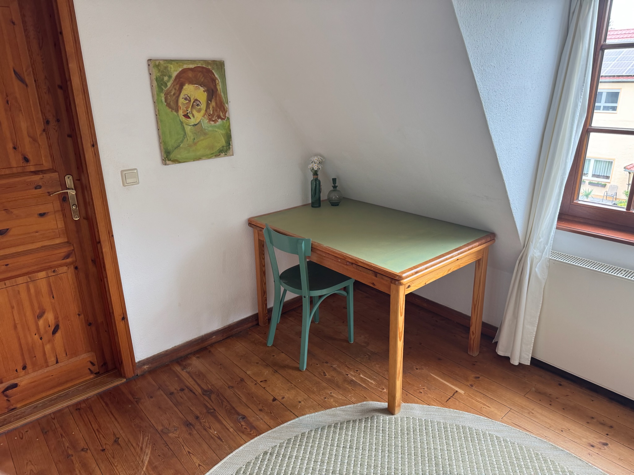 Green desk near window