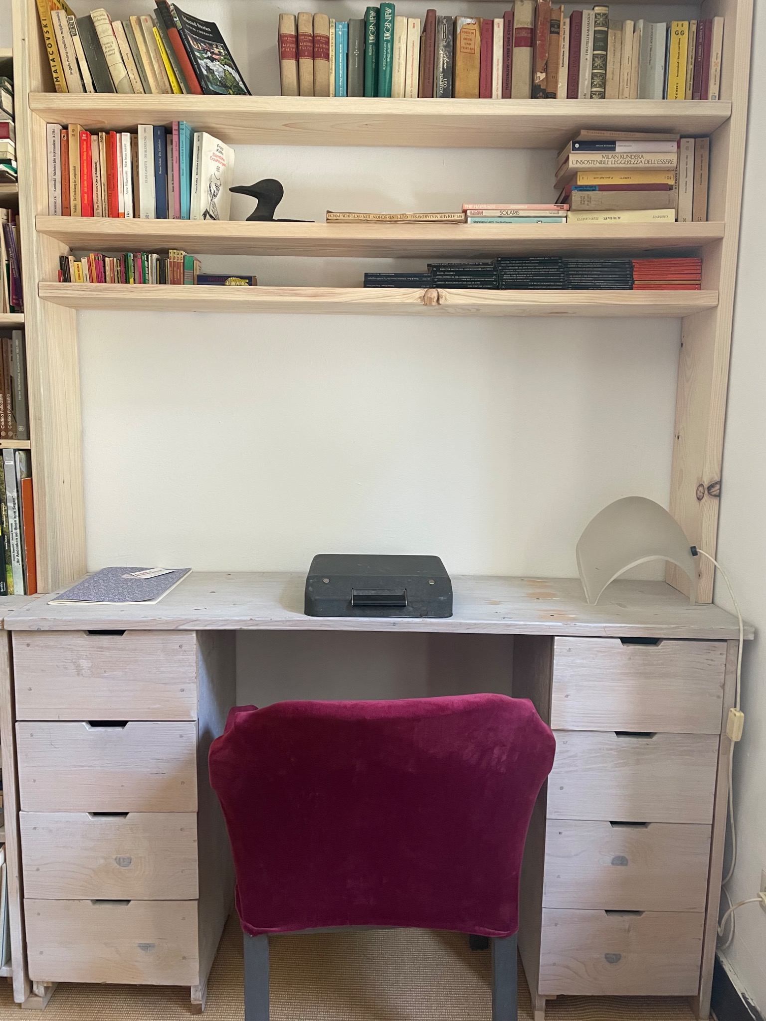 Desk with wooden chair in library